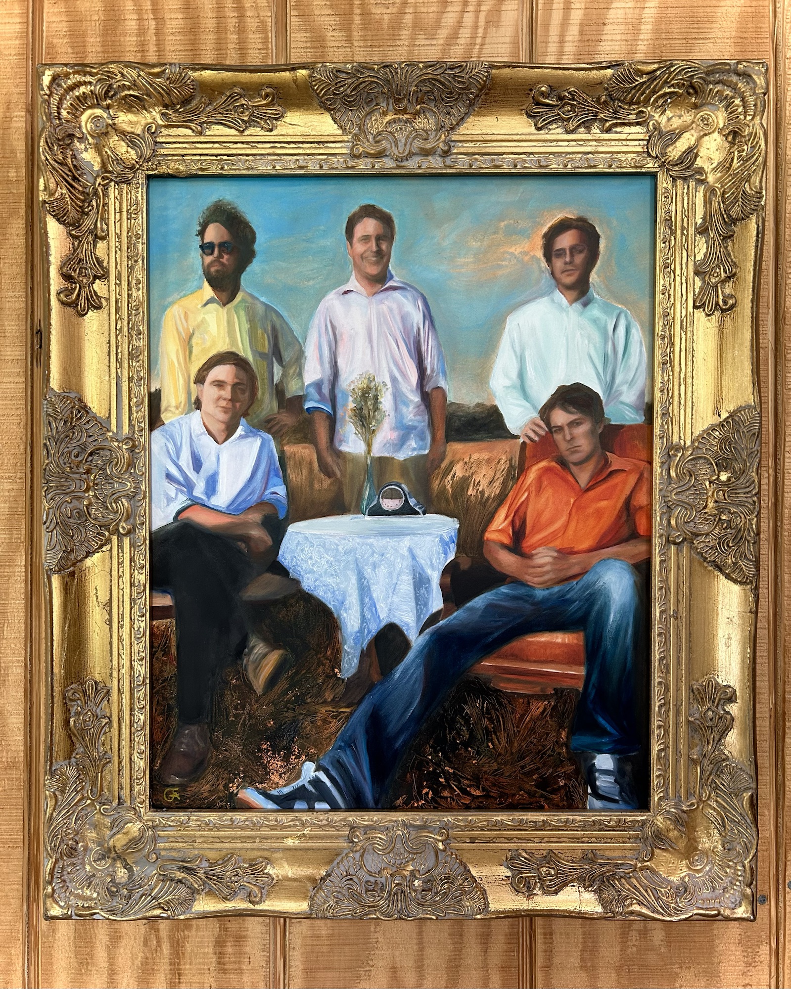 An image of a gold-framed oil painting of the band Pavement, hanging on a wall.